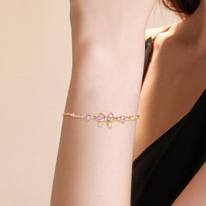 Bracelet Élégant Nœud Papillon avec Cristaux Roses – Cadeau Raffiné pour Femme