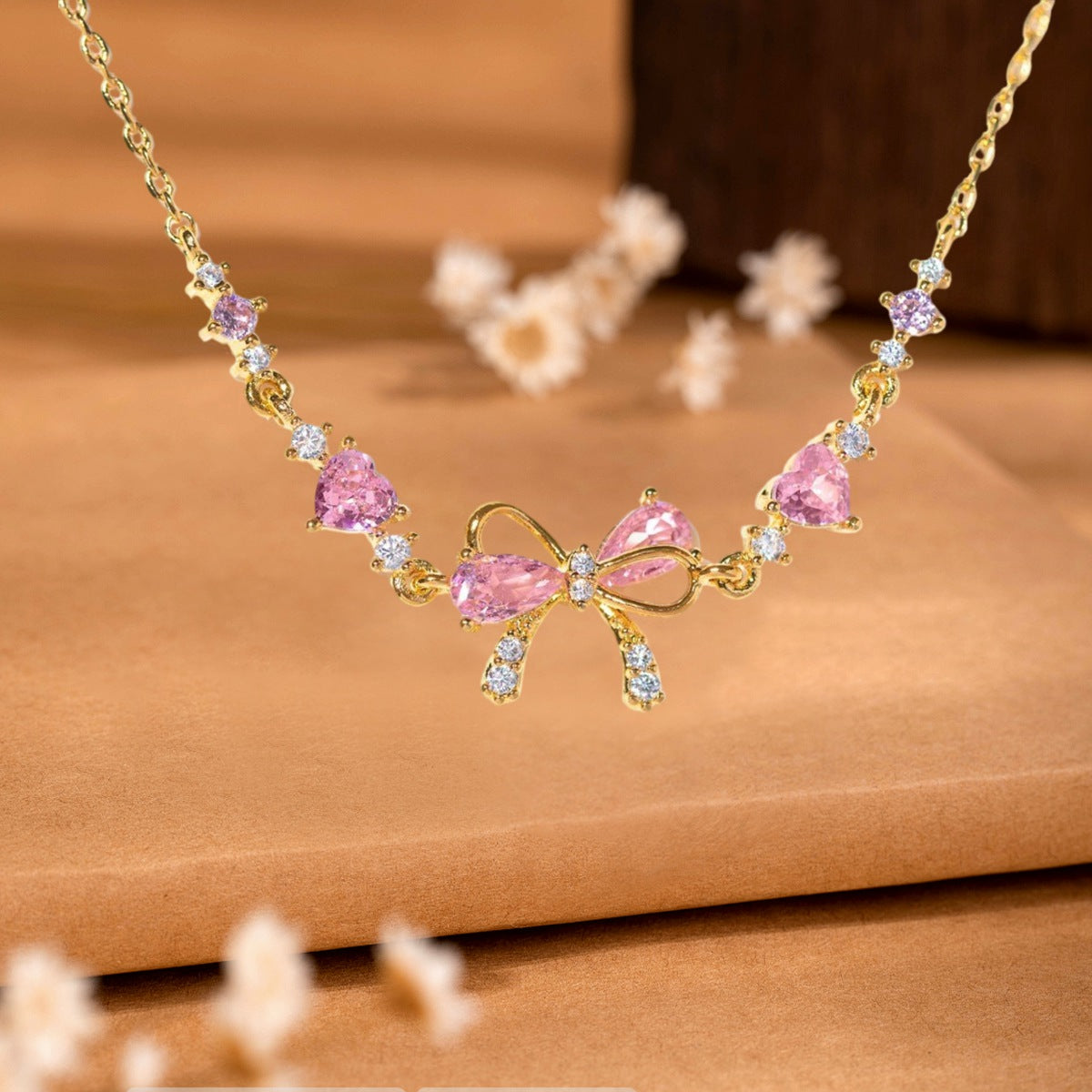Bracelet Élégant Nœud Papillon avec Cristaux Roses – Cadeau Raffiné pour Femme